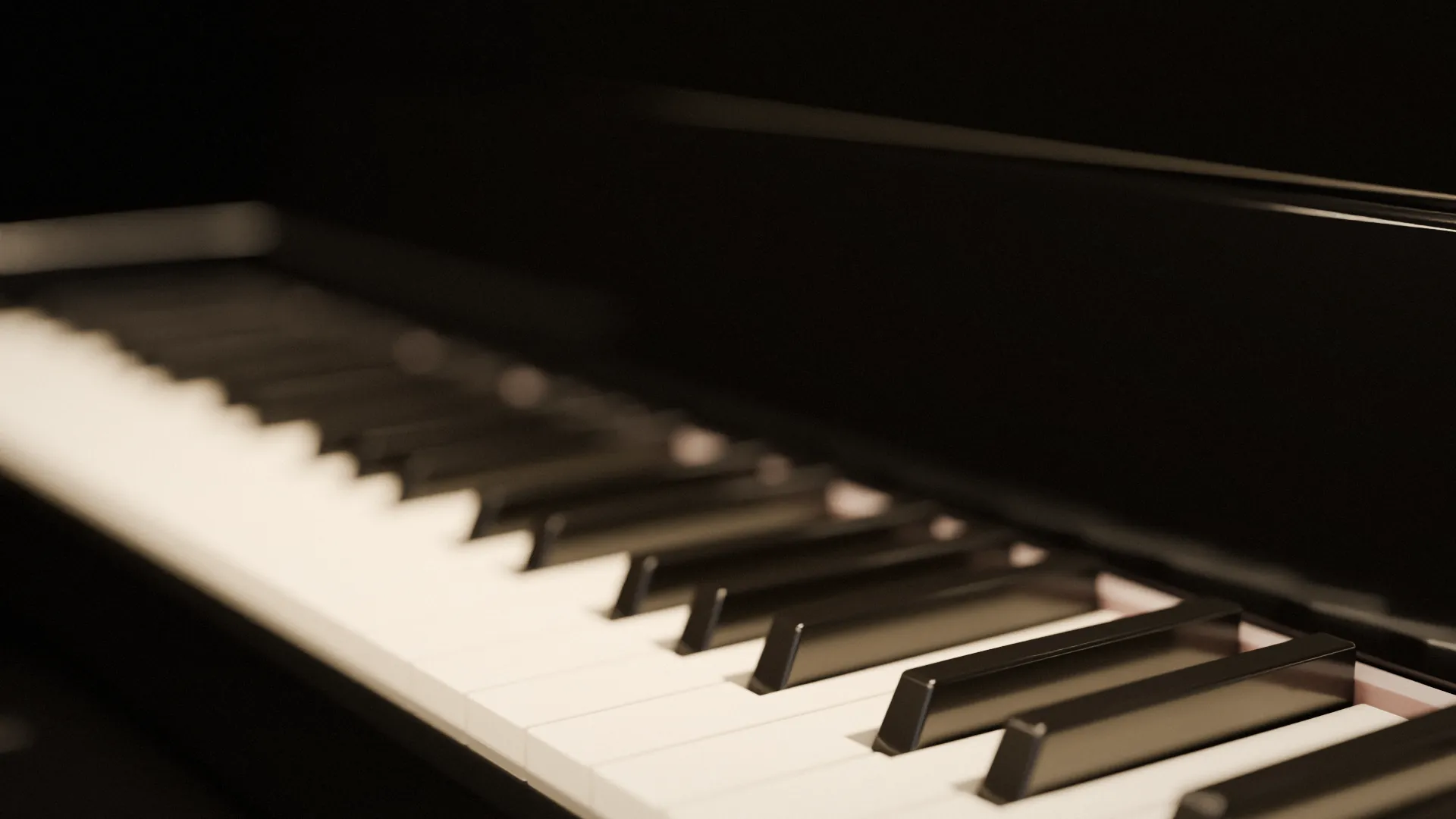 Black and ivory piano keys of a black lacquered grand piano in warm, low light